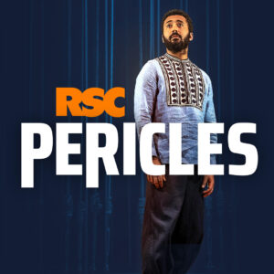 Bearded man in light blue traditional garment with "RSC PERICLES" text on a dark blue background